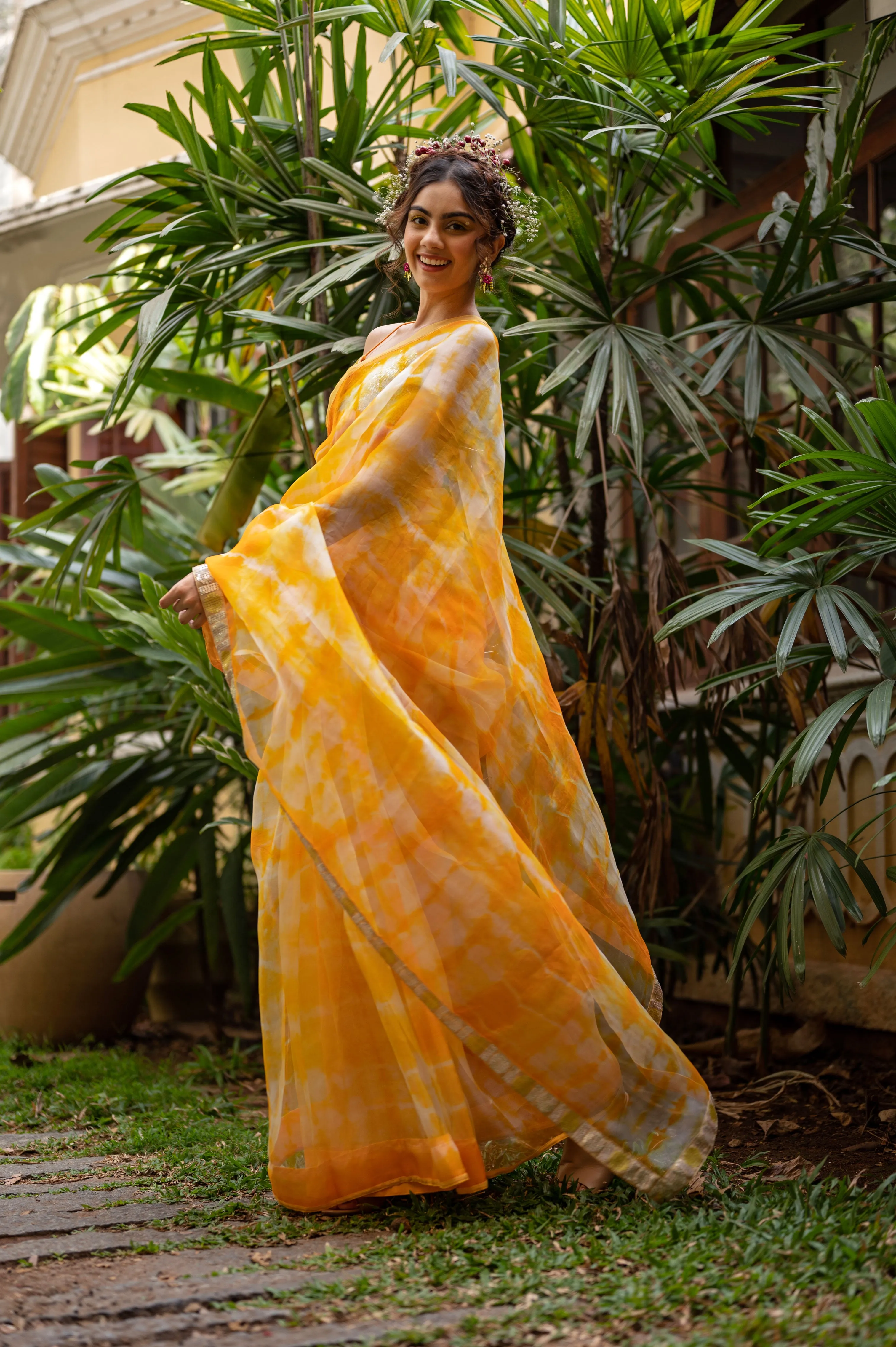 Organza tie and dye saree with hand embroidered polka sequence border